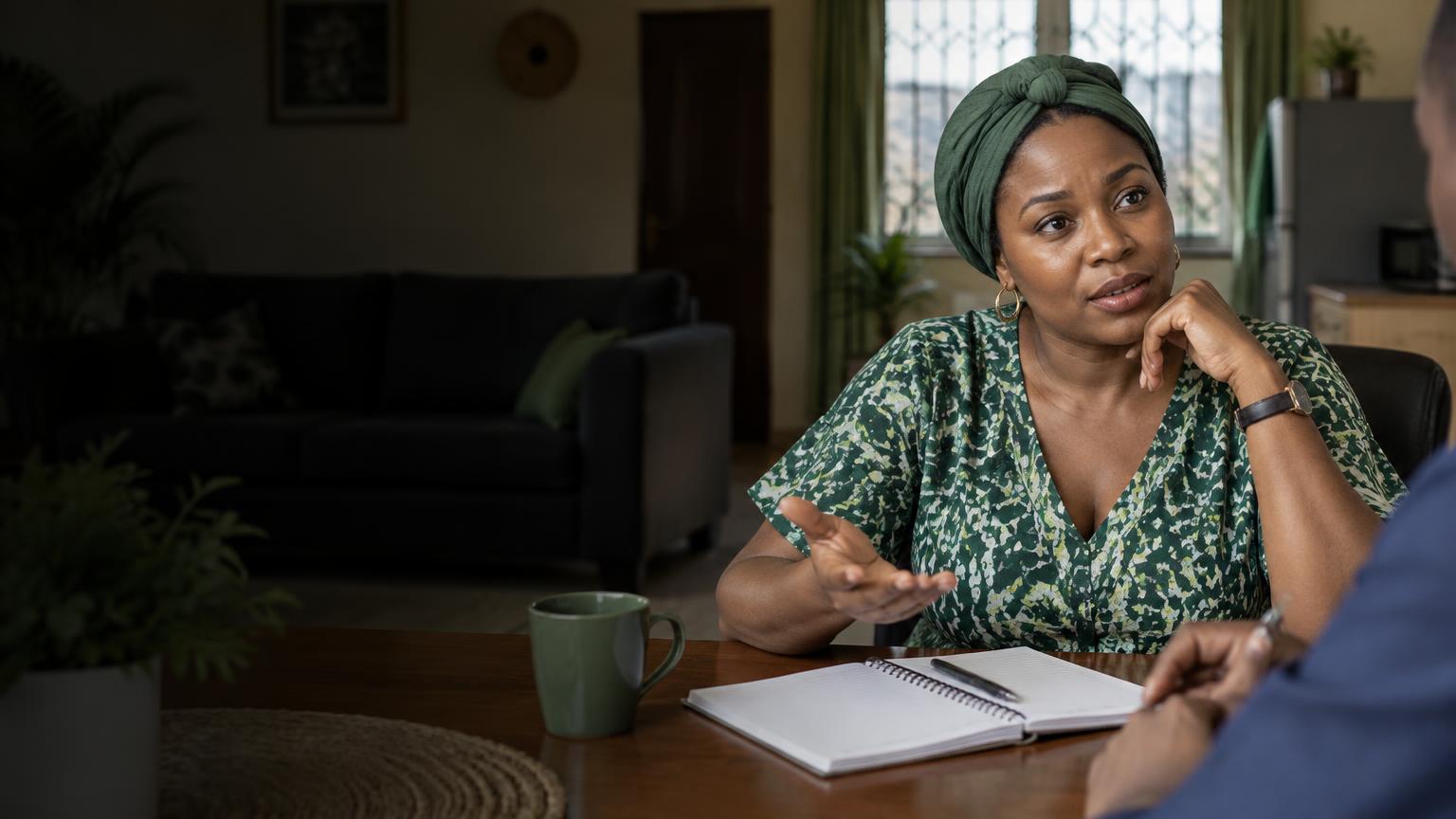 A homeowner thinking through her energy needs with an adviser